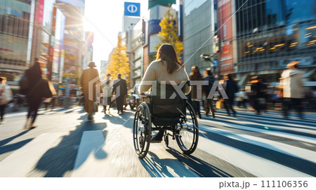 Woman Crossing Street in Wheelchair 111106356