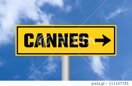 Cannes road sign on sky background 111107785