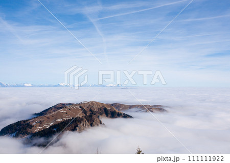 Mountain peaks emerging from the clouds 111111922