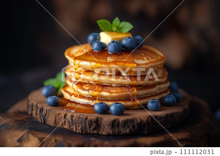 American pancakes with butter, maple syrup and blueberries. American pancakes with butter, maple syrup and blueberries. 111112031