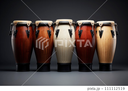 Five conga drums in row isolated on dark background. Traditional percussion musical instrument of Afro-Cuban and Latin American culture. Suitable for music-related projects and cultural designs. 111112519