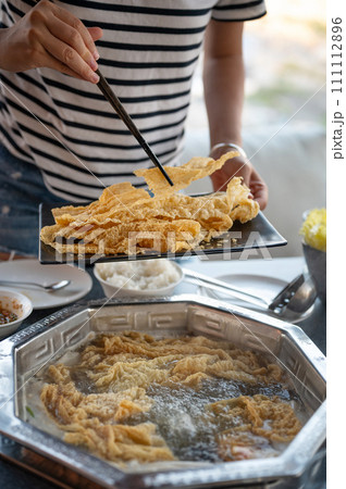 Chinese hot pot with fried tofu skin and lots of delicious ingredients 111112896