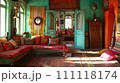 Bohemian Indian Lounge Area with Teal Walls and Colorful Textiles 111118174