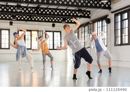 Group teenagers dancing hip-hop indoors Group teenagers dancing hip-hop indoors 111120490