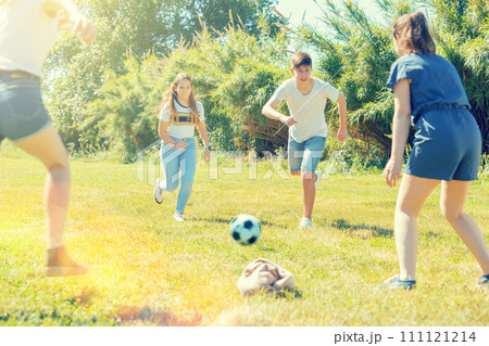 Cheerful teenagers are jogning with ball 111121214