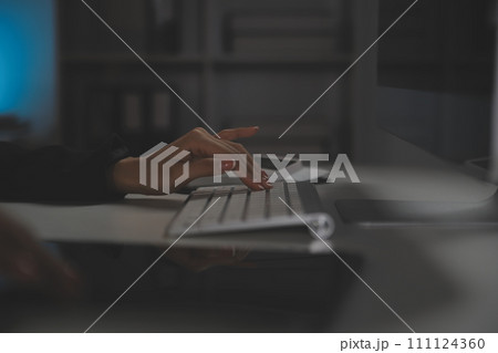 Young woman working in call centre, surrounded by colleagues Young woman working in call centre, surrounded by colleagues 111124360