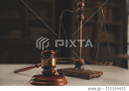 image of judge's hammer, scales lady of justice, law book, laptop computer and contract documents with pen concept of law and justice. 111124432