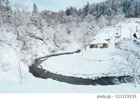 Beautiful view of Ginzan Onsen village with snow fall in winter season is most famous Japanese Hot Spring in Yamagata, Japan. Beautiful view of Ginzan Onsen village with snow fall in winter season is most famous Japanese Hot Spring in Yamagata, Japan. 111129155