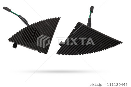 Two speakers of an acoustic system - an audio for playing music in a car interior on a white isolated background in a photo studio. Spare parts for auto repair in a workshop or for sale for tuning Two speakers of an acoustic system - an audio for playing music in a car interior on a white isolated background in a photo studio. Spare parts for auto repair in a workshop or for sale for tuning 111129445