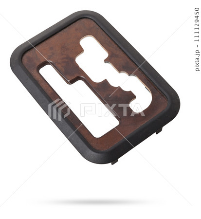 Wooden lining of a car gearbox selector on a white isolated background. Wooden lining of a car gearbox selector on a white isolated background. 111129450