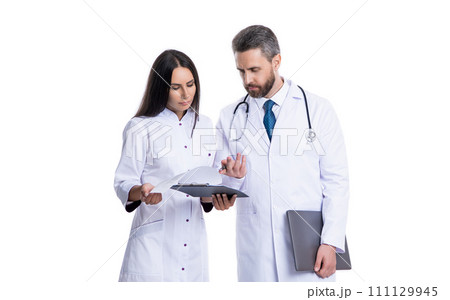 busy doctor and internist wear white coat and noting ehealth. internist and doctor busy doctor and internist wear white coat and noting ehealth. internist and doctor 111129945