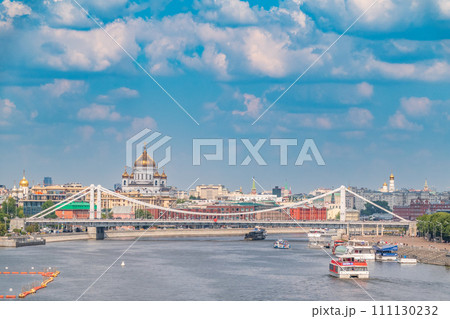 Cruise ship sails on the Moscow river in Moscow city center, popular place for walking. 111130232