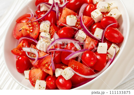 tomato salad with red onion and white cheese tomato salad with red onion and white cheese 111133875