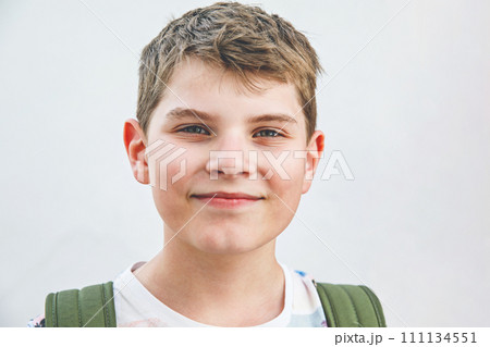 Portrait of preteen school kid boy. Beautiful happy child looking at the camera. Schoolboy smiling. Education concept. Portrait of preteen school kid boy. Beautiful happy child looking at the camera. Schoolboy smiling. Education concept. 111134551