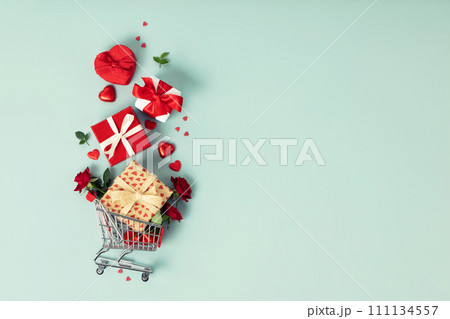 Valentine's day concept. Shopping trolley with gift boxes Valentine's day concept. Shopping trolley with gift boxes 111134557