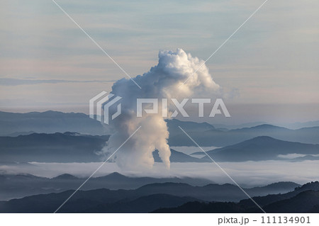 Beautiful morning scenery with fog in the background at Mae Moh Lignite Coal Power Plant, Lampang, Thailand Industrial white vapor from cooling and tower pipes, industrial and environmental themes 111134901