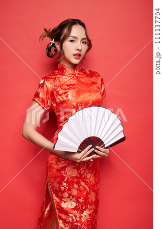 Asian chinese woman in traditional dress on red background. Chinese new year festival, 111137704