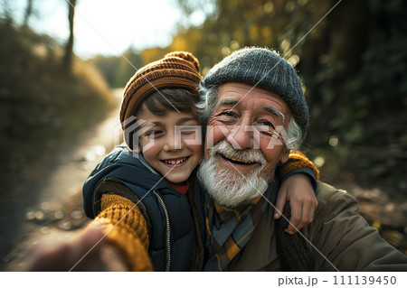 Happy senior man taking a selfie with grandson 111139450