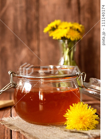 Dandelion jam in a glass jar. The concept of health. Life without cholesterol. Dandelion jam in a glass jar. The concept of health. Life without cholesterol. 111140174