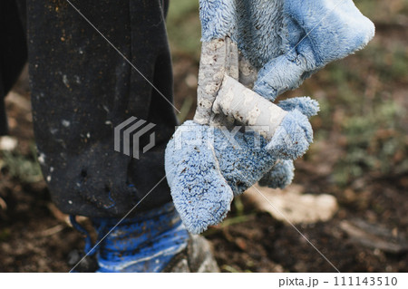 A child with his toy at war 111143510