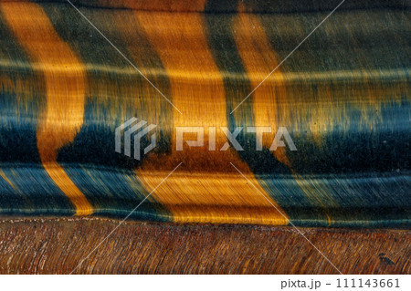 Quartz eye macro stone tiger eye on a black background 111143661