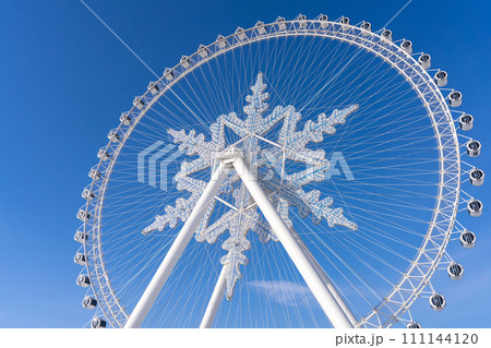 The giant snow ferris wheel in Harbin International Ice and Snow Sculpture Festival at Harbin, China. It is the world largest ice and snow festival. 111144120