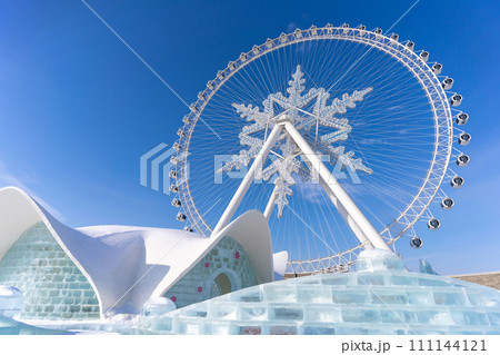 The giant snow ferris wheel in Harbin International Ice and Snow Sculpture Festival at Harbin, China. It is the world largest ice and snow festival. 111144121