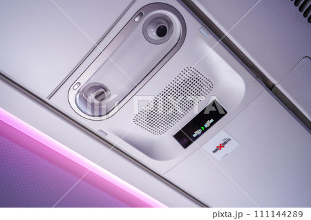 Commercial aircraft interior in airplane cabin, Overhead compartment Commercial aircraft interior in airplane cabin, Overhead compartment 111144289