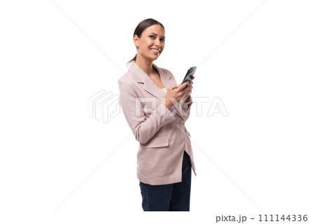 young confident caucasian woman with a ponytail hairstyle dressed in a jacket and jeans uses a young confident caucasian woman with a ponytail hairstyle dressed in a jacket and jeans uses a 111144336