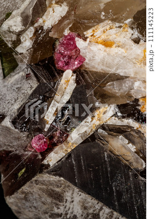 Macro mineral quartz mineral Tourmaline on Lepidolite black background 111145223
