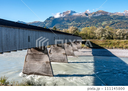 The historic old Rhine bridge between Liechtenstein and Switzerland The historic old Rhine bridge between Liechtenstein and Switzerland 111145800