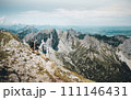 Three Hikers on a hiking trail on Hochplatte Mountan in the Ammergau Alps 111146431