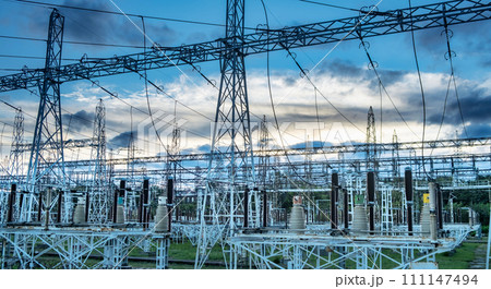 Sunset behind substation towers with blue sky Photo Sunset behind substation towers with blue sky Photo 111147494