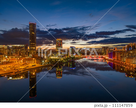 Yekaterinburg city and pond aerial panoramic view at summer or early autumn night. Night city in the early autumn or summer. 111147859