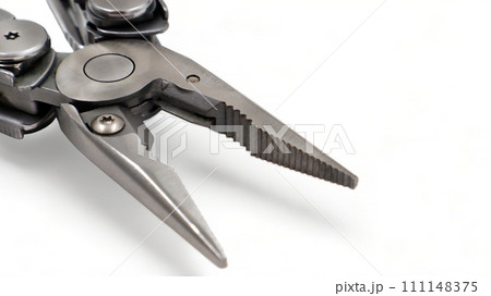 One modern gray iron open folding multifunctional knife on a white background. Multi-tool with advanced tools. Pliers close up. Compact and portable product. Pocket knife. EDC concept. Copy space One modern gray iron open folding multifunctional knife on a white background. Multi-tool with advanced tools. Pliers close up. Compact and portable product. Pocket knife. EDC concept. Copy space 111148375