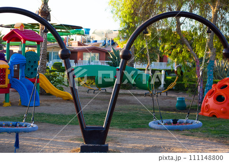 Swing nest on a playground on a sunny day. Outdoor play space for young children with park 111148800