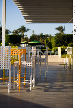 Summer cafe with colored wicker furniture on the terrace with fresh air on a sunny day 111148838