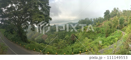 The road is in the middle of forests and mountains which are cloudy and cool The road is in the middle of forests and mountains which are cloudy and cool 111149553