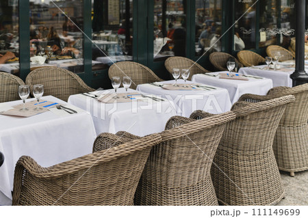 Traditional Parisian cafe with wicker chairs Traditional Parisian cafe with wicker chairs 111149699