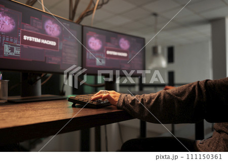 Woman hacker coding virus program, typing on keyboard. Cyberattack, online criminal programming malicious software and malware, hacking computer system, writing encryption. Close up. Woman hacker coding virus program, typing on keyboard. Cyberattack, online criminal programming malicious software and malware, hacking computer system, writing encryption. Close up. 111150361