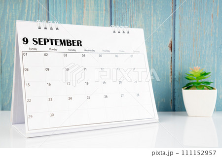 September 2024 calendar on the white table with wooden background. 111152957