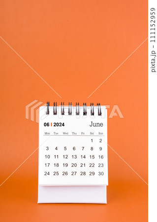 Vertical of June 2024 table calendar on orange background. 111152959