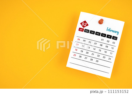 February 2024 calendar page with push pin on yellow. 111153152
