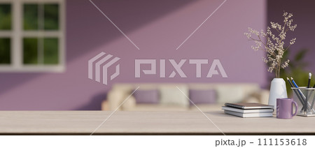 A space on a minimal wood tabletop with a blurred background of a modern purple living room. A space on a minimal wood tabletop with a blurred background of a modern purple living room. 111153618