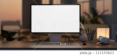 A white-screen computer mockup on a hardwood desk in a modern home office during sunset time. 111153621