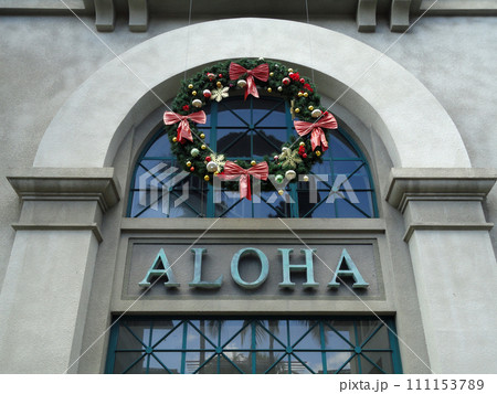 The Word Aloha and Christmas Wreath on side of Aloha Tower 111153789