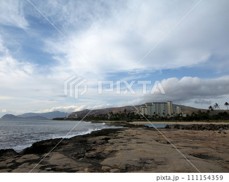 Rocky shoreline next to lagoon at Ko Olina Rocky shoreline next to lagoon at Ko Olina 111154359