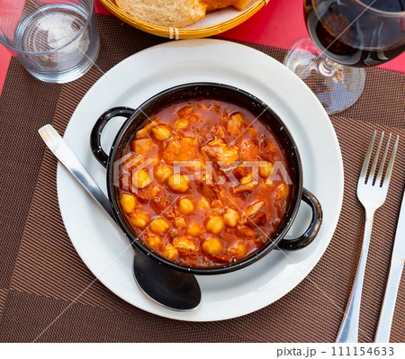Stewed tripe callos with vegetables, garbanzo and chorizo 111154633