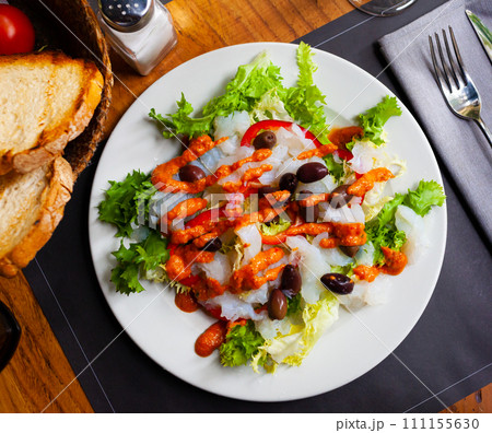 Traditional catalan salad Xatonada with crumbled cod Traditional catalan salad Xatonada with crumbled cod 111155630
