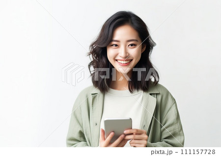 AI-generated content. Young adult smiling happy korean woman holding mobile phone on white background Generative AI AI-generated content. Young adult smiling happy korean woman holding mobile phone on white background Generative AI 111157728